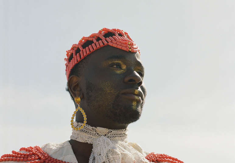 The picture shows the writer, director, performer and choreographer The picture shows the writer, director, performer and choreographer Sonny Nwachukwu with coloured accessories and a golden makeup with colourful accessories and a golden makeup