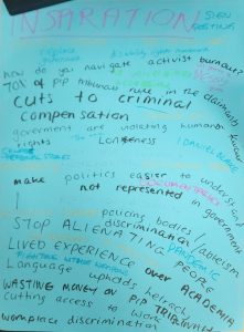 This image is a handwritten brainstorm or mind map on a light blue sheet of paper, similar to the previous one. The title "INSPIRATION" is written in large, bold pink letters at the top, with "SIGNPOSTING" in smaller pink letters to its right. The rest of the page is covered with words and phrases, seemingly related to social justice, disability rights, and political issues, written in a mix of black, light blue, pink, and yellow ink. Key phrases and words visible include: Black Ink:** "how do you navigate" "70% of pip tribunals" "cuts to criminal compensation" "government are violating humans rights" "Loneliness" "make politics easier to understand" "not represented in government" "STOP ALIENATING" "LIVED EXPERIENCE" "Language upholds heirachy" (likely "hierarchy") "WASTING money on pip tribunal" "cutting access to work" "workplace discrimination" *Light Blue Ink (mixed in with black):** "replace" (near "government") "rule in the claimants" "support" "policing bodies / ableism" "discrimination" "PANDEMIC" "PEOPLE" "ACADEMIA" "over" (near "people") Pink Ink (smaller, scattered):** "MESSY" (near "burnout?") "from" (below "MESSY") Yellow Ink (smaller, scattered):** "disability rights movement" "activist burnout?" "CENSORED PERSONAL STORIES" "I DANIEL BLAKE" (likely referencing the film *I, Daniel Blake*) "FIGHTING WITHOUT WEAPONS"